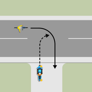 A blue motorcycle is indicating left to turn onto the continuing road from a drive way. A bicycle is approaching from the left and wants to turn into the driveway. The motorcycle must give way to the cyclist.