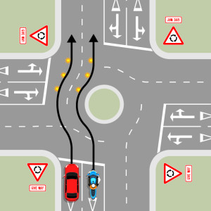 A blue motorcycle is approaching a multi-laned roundabout with four exits, each with give way signs. A black arrow shows the motorcycle does not indicate until it is past the exit before the exit it is taking, then it signals left. The motocycle stays in 