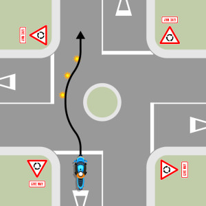 A blue motorcycle is approaching a single-laned roundabout with four exits, each with give way signs. A black arrow shows the motorcycle does not indicate until it is past the exit before the exit it is taking, then it signals left. 