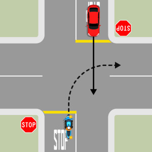 Two cars on opposite sides of the intersection behind stop signs. The blue motorcycle is turning right. The red car is driving straight through. The motorcycle must give way to the red car.