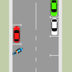 On a road with parked cars, a blue motorcycle is parked facing out at an angle from the kerb.