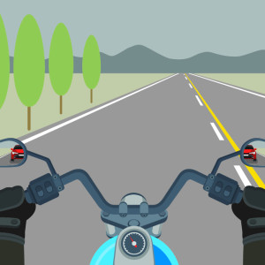 Point of view of rider on motorcycle. Two mirrors show the riders view of behind them.