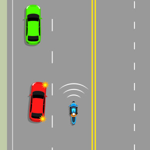 A blue motorcycle ans a red car are side by side on 2 lanes. A green car is ahead of the red car. the rd car is indicating to pull out in front of the motorcycle to pass the red car. the motorcycle is tooting their horn to warn the red car they're there.