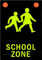 Sign showing children symbol and says school zone underneath