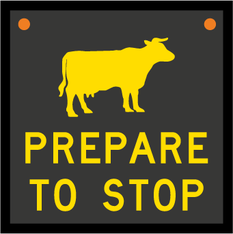 Sign of a cow or sheep with prepare to stop text