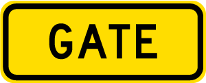 Warning sign which says gate on yellow rectangular background