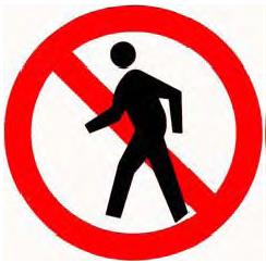 Traffic sign showing a pedestrian symbol with a red slash prohibition and a red circular border