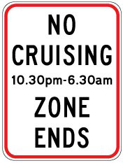 Traffic sign which says no cruising 10.30pm-6.30am zone ends and it has red border