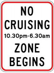 Traffic sign which says no cruising 10.30pm-6.30am zone begins and it has red bordre