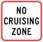Traffic sign which says no cruising zone and it has red border