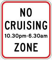 Traffic sign which says no cruising 10.30pm-6.30am zone and it has red border