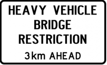 Sign saying: heavy vehicle bridge restriction 3km ahead