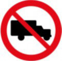 Traffic sign of a black truck symbol with red slash prohibition and circular border