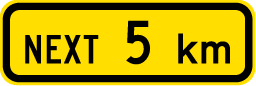 Traffic sign which says next 5 km on rectangular yellow background