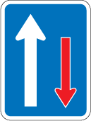 Traffic sign which displays one big white arrow pointing up while next to it is smaller red arrow pointing down and it has a blue rectangular background