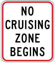 Traffic sign which says no cruising zone begins and it has red border