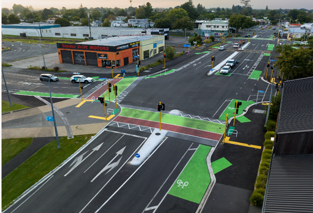 Photo from a birds eye view of an intersection with newly installed raised safety platforms and cycle lanes