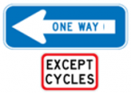 Blue sign with left arrow and the words one way sign another white sign with the words except cycles