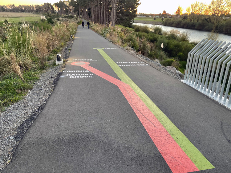 Painted directions along a shared pathway.