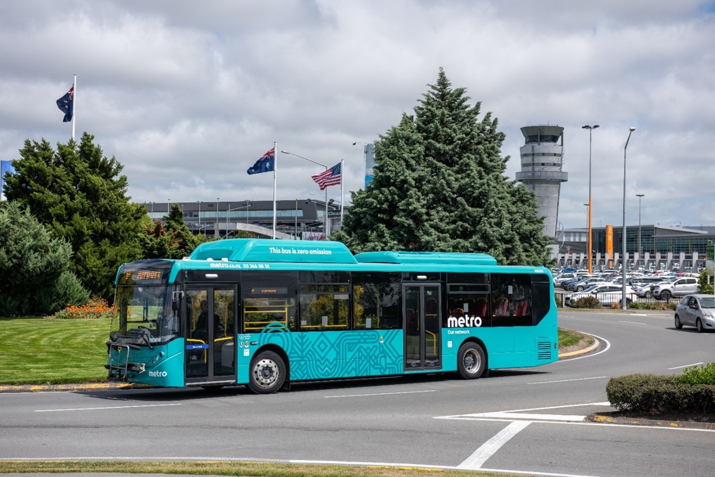 Electric bus travelling around a roundabout near Christchurch Airport