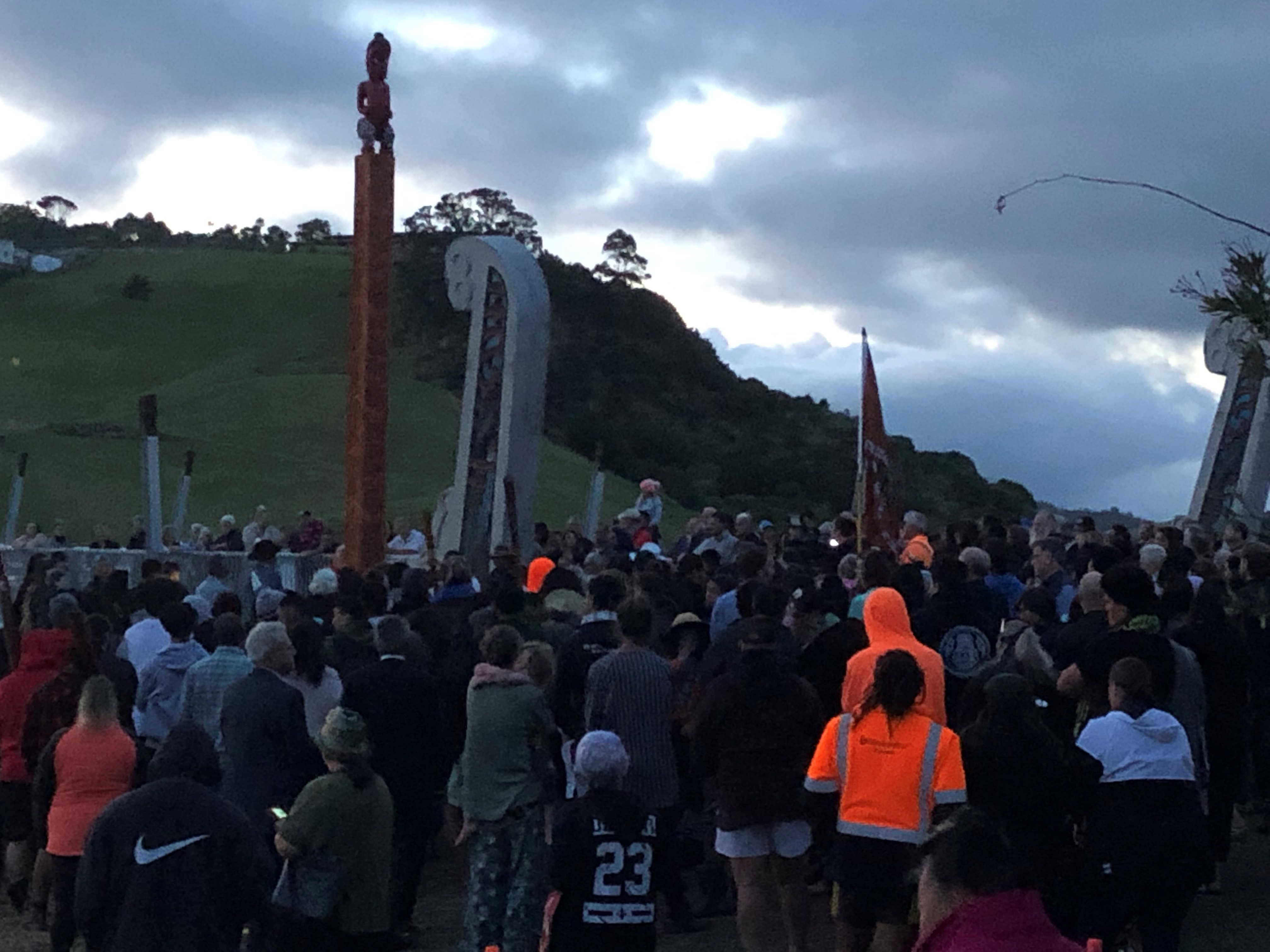 A crowd gather at dawn to witness the dawn blessing at the new Taipā Bridge 