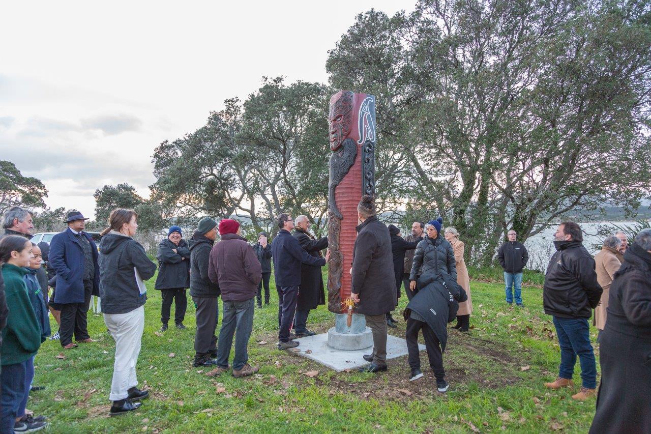 Matapihi 21 – The pou whenua surrounded by attendees of this morning’s blessing and unveiling