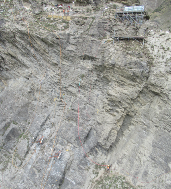 Abseilers so a large cliff face