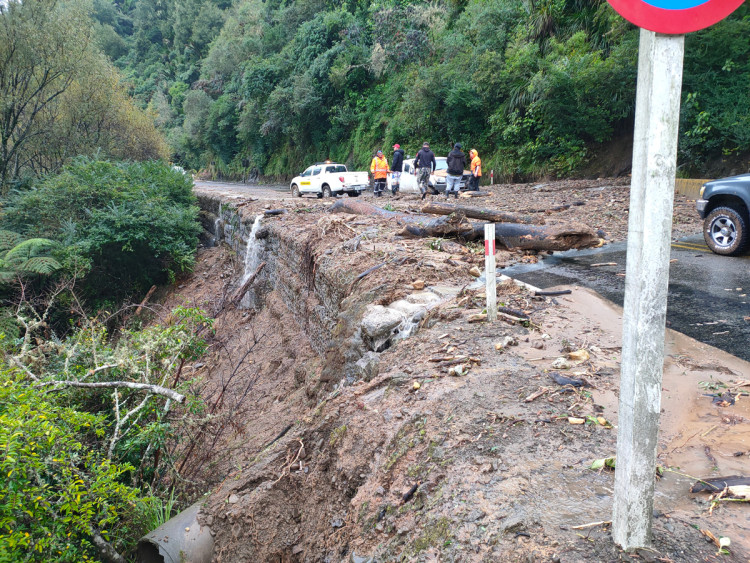 damaged road with debris causing blockage