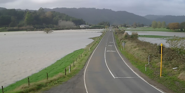 stretch of road next to overflowing river