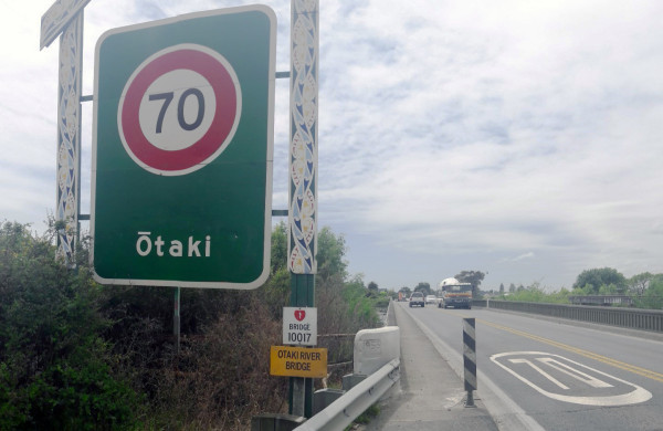 large green information sign on the highway with 70 and Otaki name