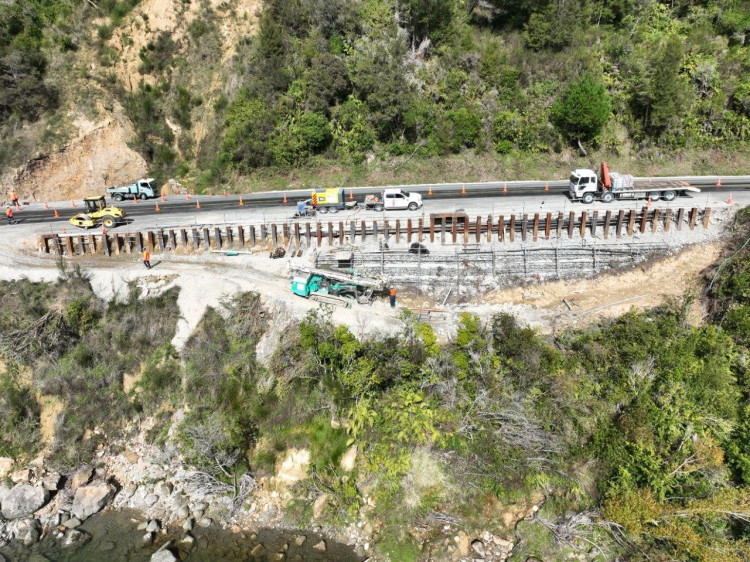 aerial view of the coastal road with barrier wall construction works