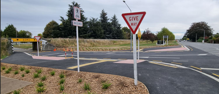Newly upgraded  road intersection with a give way sign