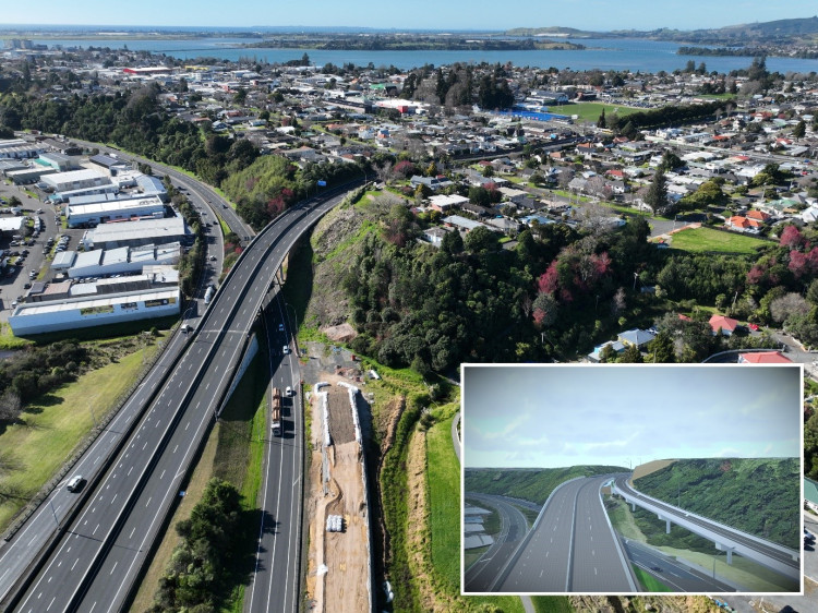 Aerial view showcasing a highway with a bridge, surrounded by a bustling cityscape below.