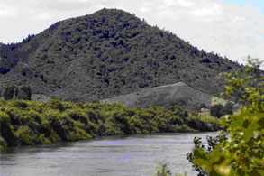 Taupiri maunga (mountain) rising in the background with Waikato River in the foreground