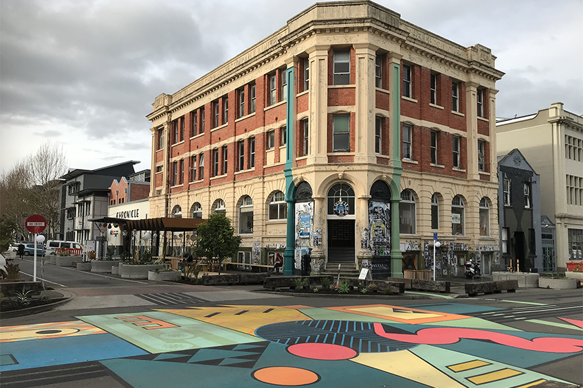 Street art mural in front of historic building in Whanganui town centre