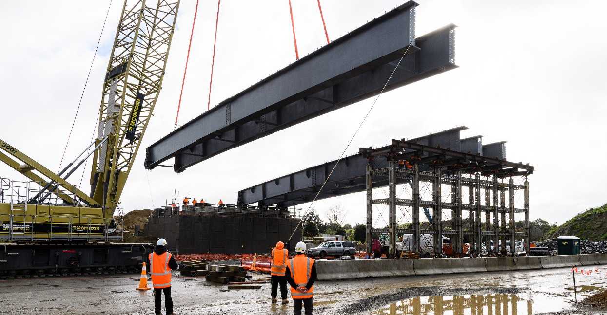 The beams are placed on the Rāhui Road Bridge.