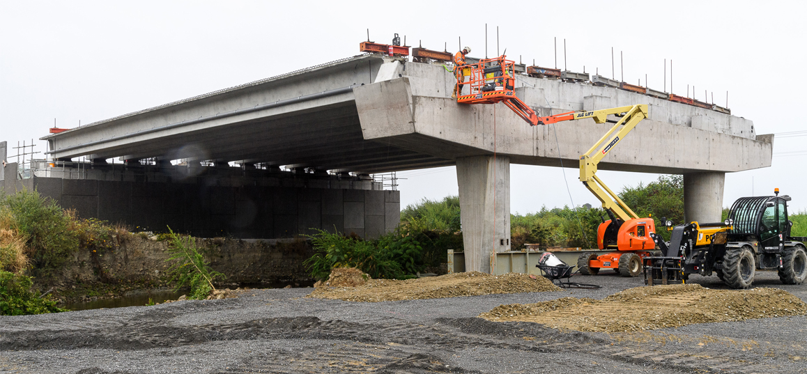Construction workers placing beams on Bridge 1.