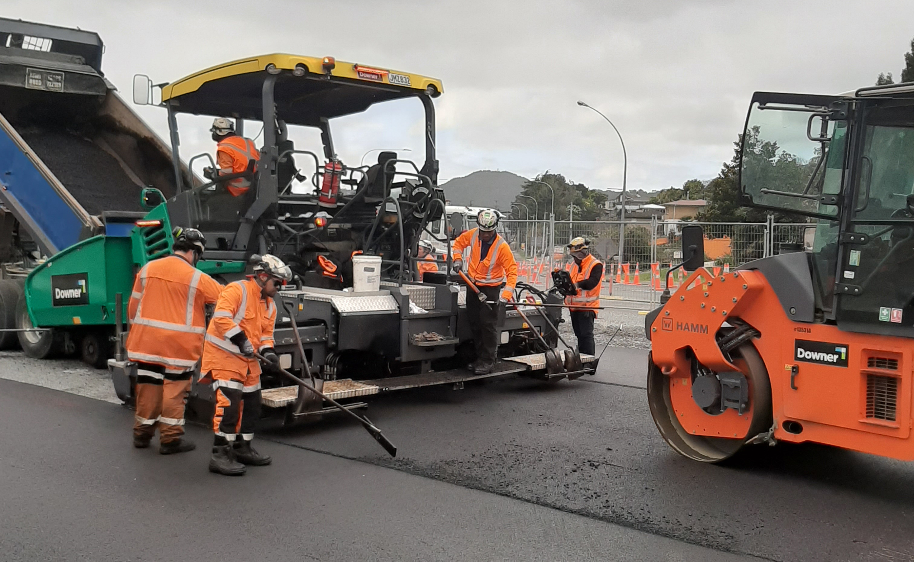Crews apply a top layer of seal on SH1 at the Tarewa Road intersection