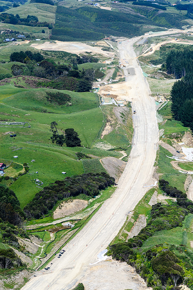 Aerial view of new motorway through Battle Hill Farm Forest Park.