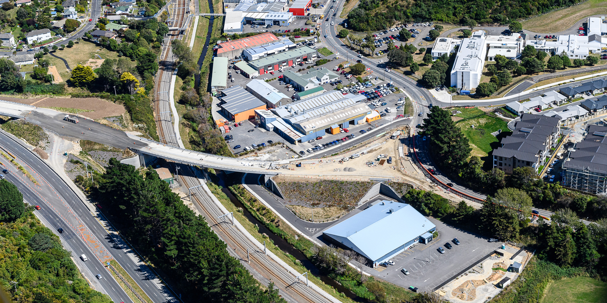 Aerial view over new Kenepuru interchange with road still under construction.