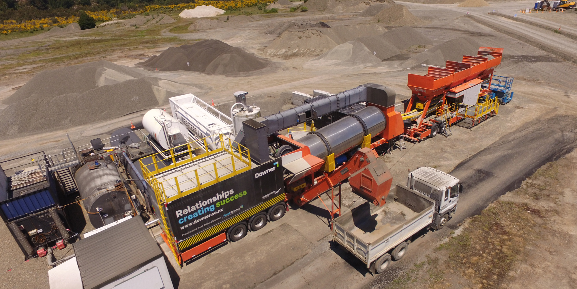 Mobile asphalt plant with an empty truck waiting to be filled.