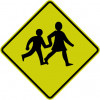 A yellow diamond with a black border and two children holding hands and walking