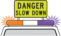 Heavy haulage fluro yellow green sign mounted on top of the pilot vehicle with flashing lights that says danger slow down