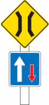 Two signs combined on one post, the top one is a permanent warning traffic sign on a yellow background showing a narrow bridge icon and the other is a directional sign with a blue background showing one white arrow going up and the other smaller red arrow going down. This combo signage means oncoming traffic on a one-way or narrow bridge must give way to you.