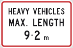 Regulatory traffic sign says heavy vehicles max length 9.2 m and it has a rectangular red border