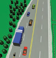 In a busy traffic road where the two lanes are merging into one lane, a heavy vehicle is about to merge with the rest of the traffic carefully and safely into the wide gap between two cars. 