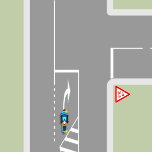 Blue motorcycle indicating turning right from a right turn bay with median strip.