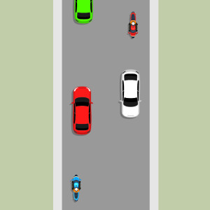 An unlaned road with motorcycles and cars travelling in different directions, keeping to the left side.