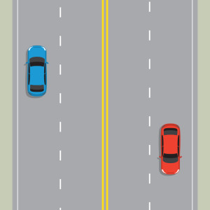 4 laned road with double yellow line down the middle. Blue car and red car keeping to the left.
