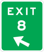 A green oblong with white border that reads with white text reading exit, the number 8 and an arrow pointing to the upper left.